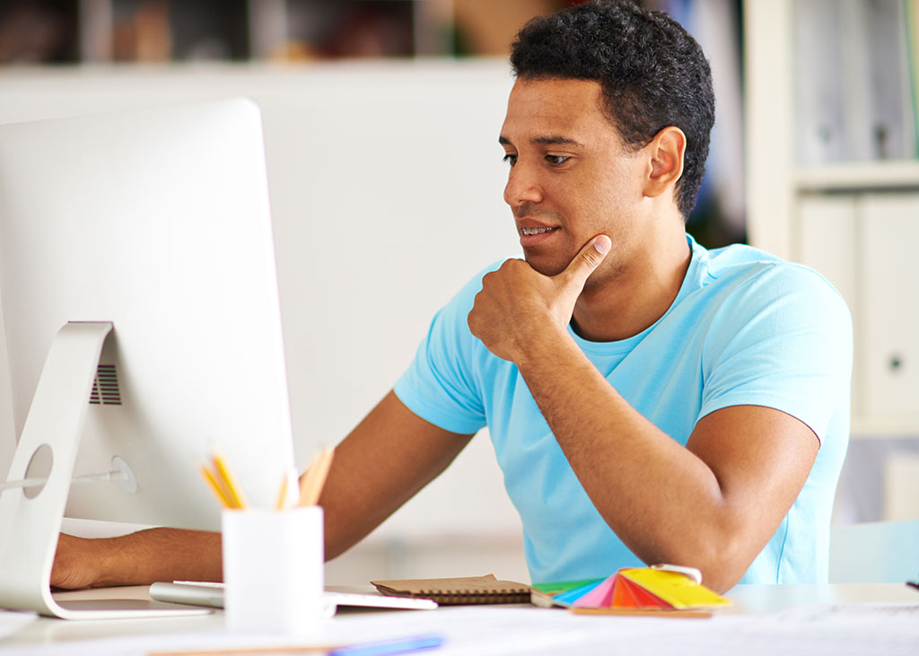 man working in front of computer