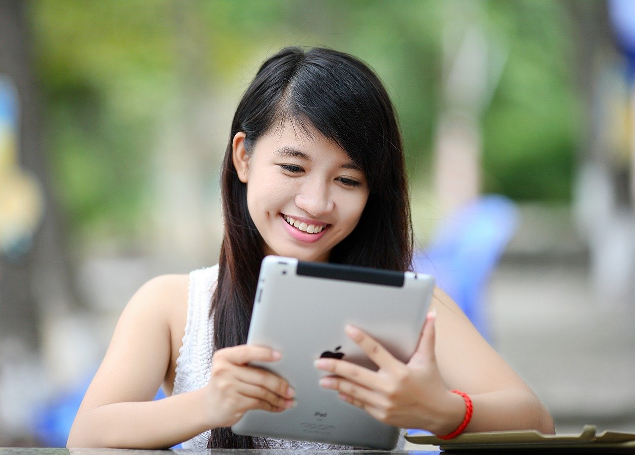 girl looking at ipad