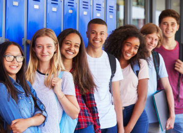 students in front of lockers