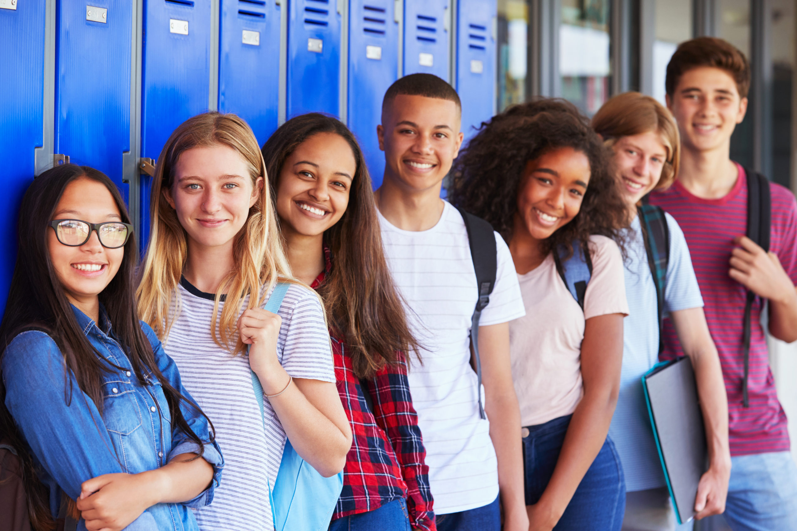 students in front of lockers