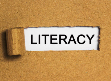 The text" literacy" behind torn brown paper