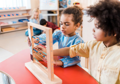 two students using an abacus