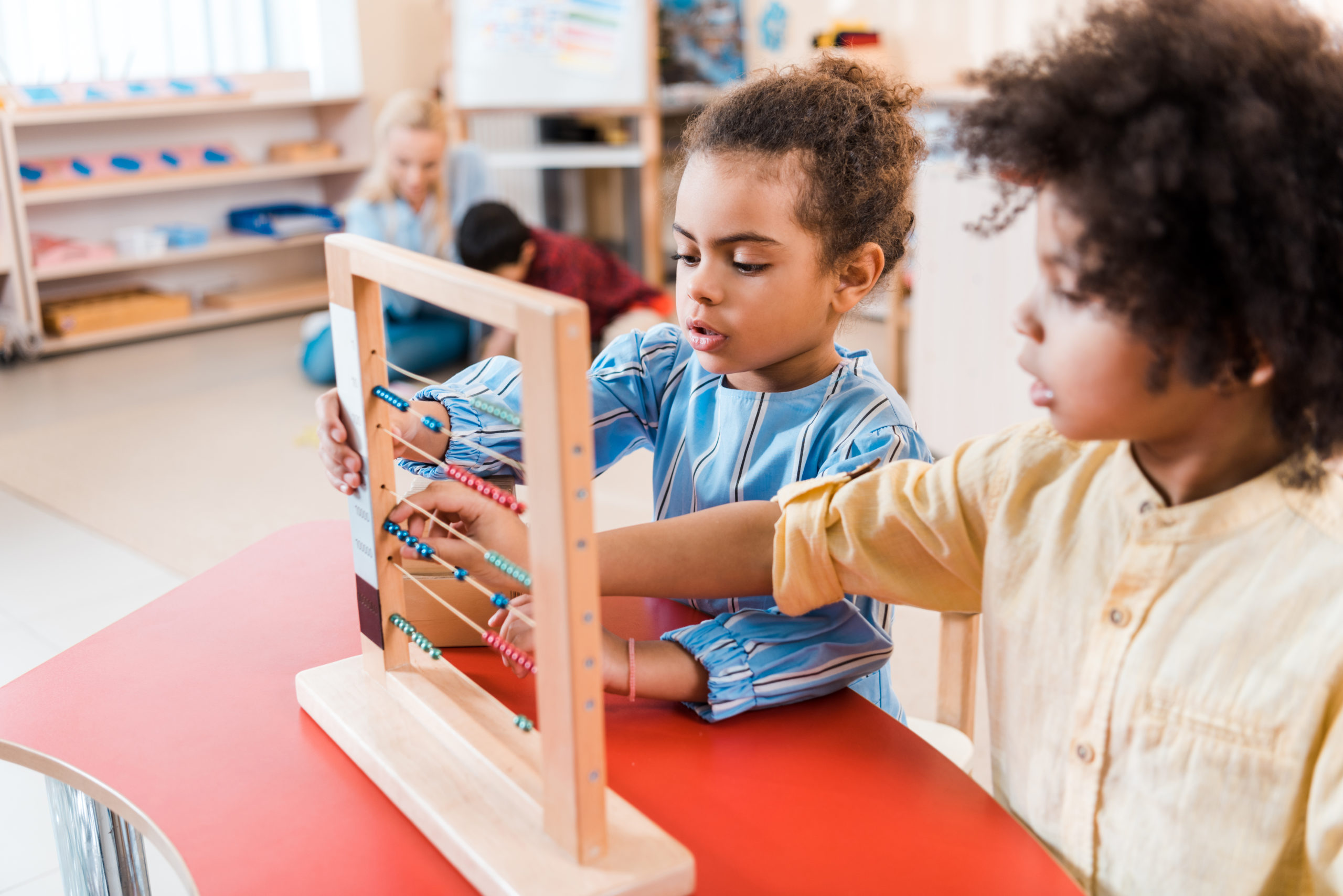 two students using an abacus